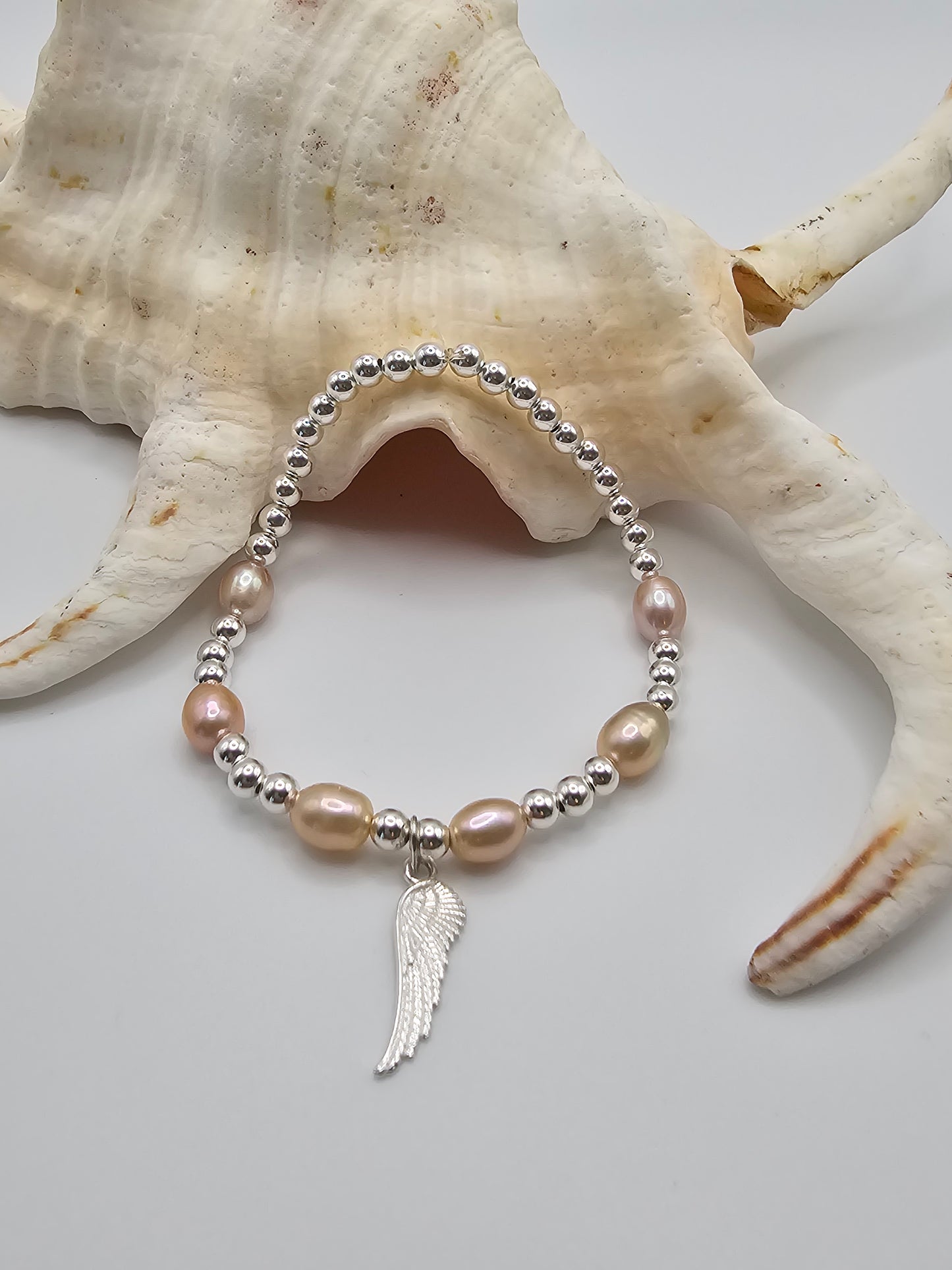 Sterling Silver Stretch Bracelet with Cultured Freshwater Pearls and Sterling Silver Angel Wing